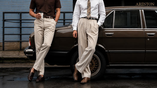 Two men wearing tailored pleated and flat-front trousers